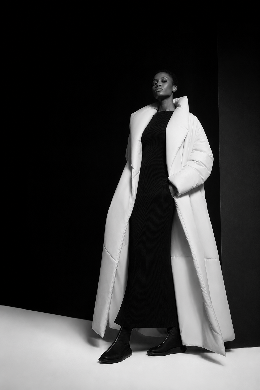 Model in a white sculptural coat from the Just Life monochrome campaign